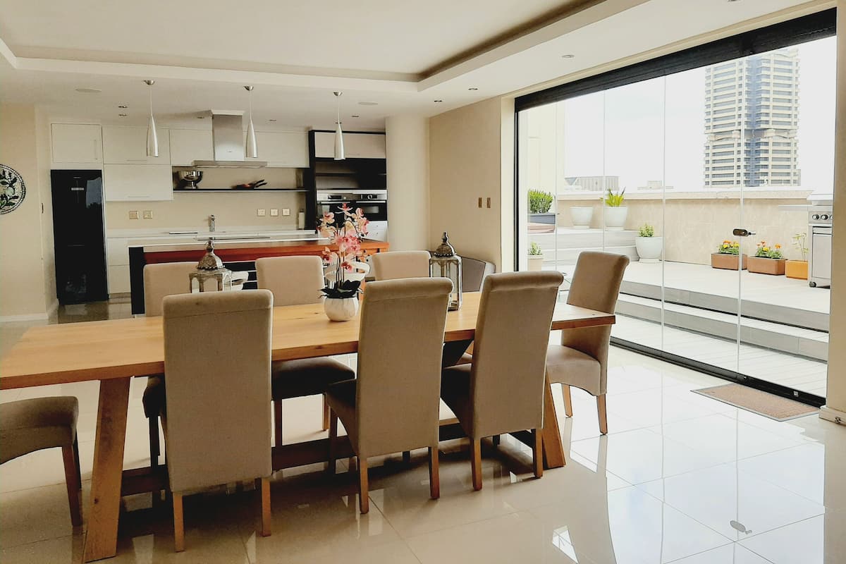 Presidential Penthouse | Living area | 55-inch Smart TV with cable channels, Netflix, streaming services