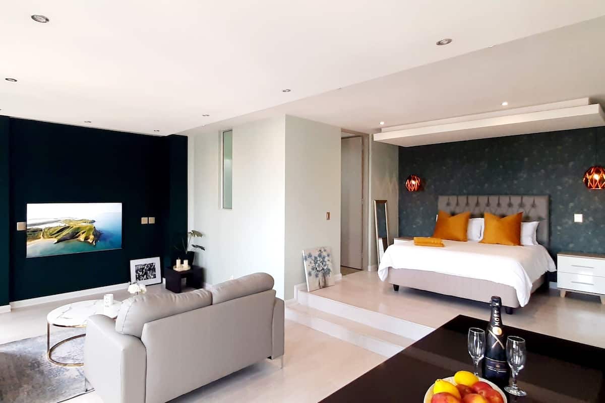Luxury Studio | Living area | 55-inch Smart TV with cable channels, Netflix, streaming services