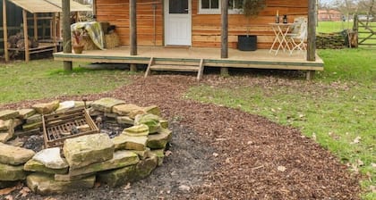 Cosy Lodge completely on your own in an acre of land. and will take 2 dogs