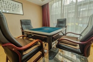 A room with a pool table, leather chairs, and a large window. - Guangzhou No.6 Inn (Panyu District Ha Street Branch) (Guangzhou)