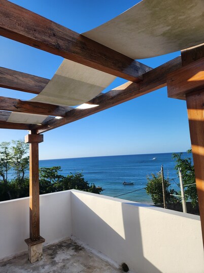 3 bd condo with rooftop across the street from beach!