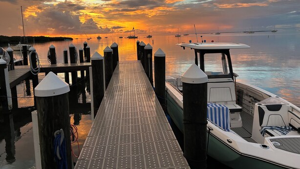 A pier with boats docked, a clear sky, and calm water. - Islamorada Florida Bay Villa  Plunge Pool, Boat Dock, Amazing Sunset Views (Islamorada)