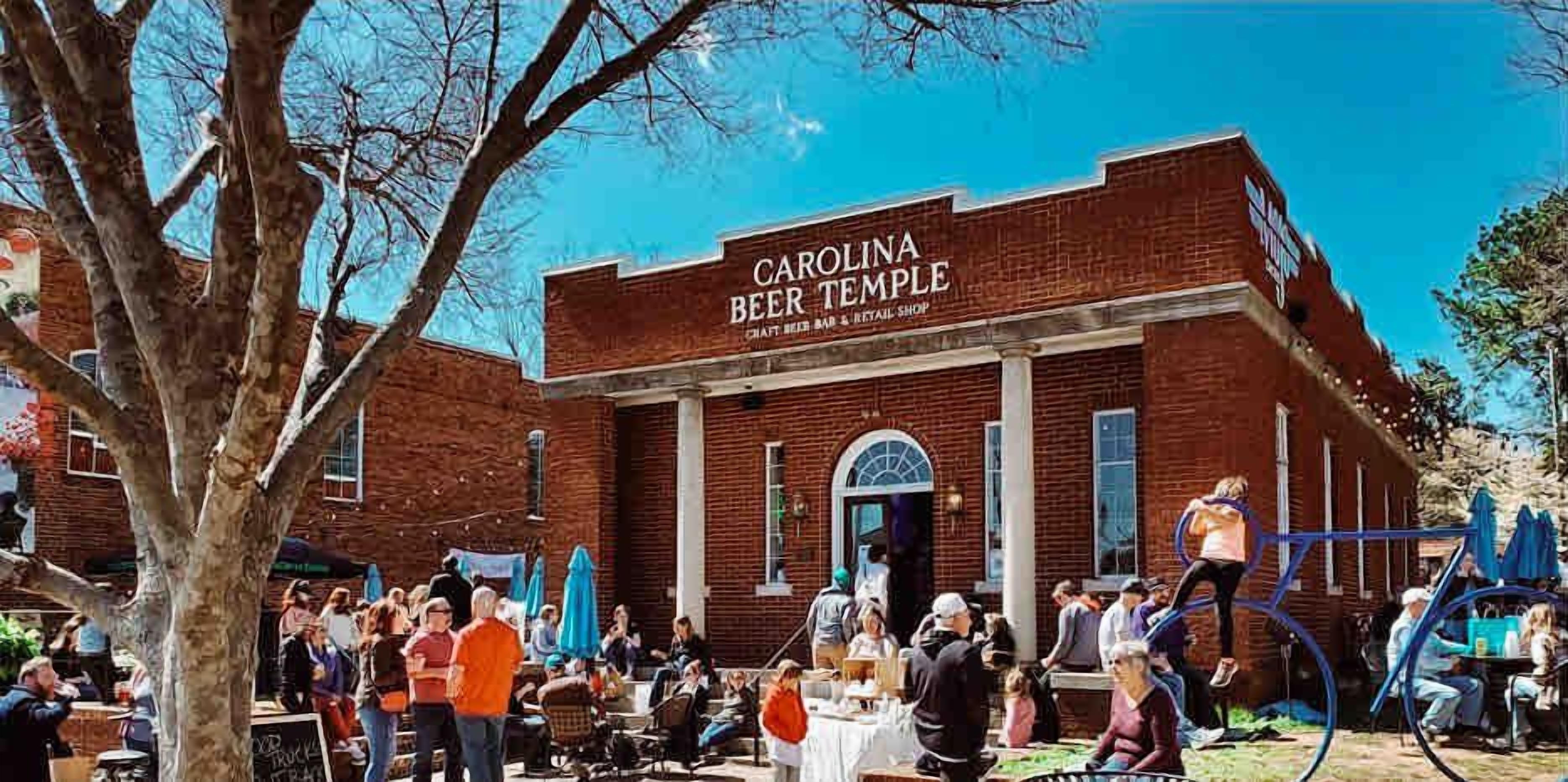 A brick building with a sign reading 'CAROLINA BEER TEMPLE.'