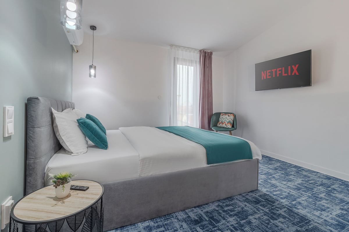 Premium bedding, memory foam beds, desk, laptop workspace