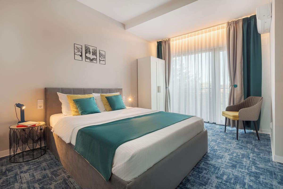 Premium bedding, memory foam beds, desk, laptop workspace