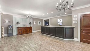 A spacious kitchen with a central island, a chandelier, and a sign indicating 'Quality' on the wall. - Quality Inn & Suites Santee I-95 (Santee)