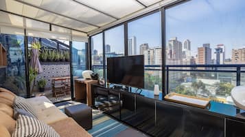 Exclusive Apartment | Living area | 32-inch TV with satellite channels