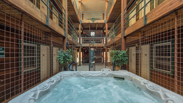 A spa area with a hot tub, wooden walls, and a skylight. - Perfect Location! King Bed, Full Kitchen, Walk To Gondola 2 Bedroom Condo by RedAwning (Telluride)