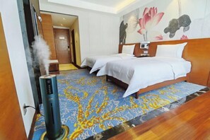 A hotel room with two beds, a massage chair, and a large floral mural on the wall. - Tibet Ali Hotel (Gar County)