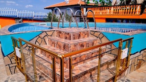 A pool area with a stone staircase and metal railings. - Sea Marble Villa Studio (Sozopol)