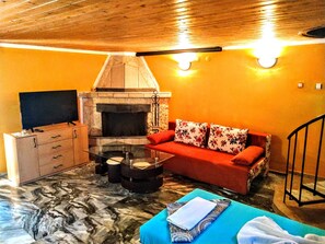 Studio | Wohnbereich | Kamin