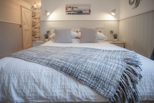 2 bedrooms, premium bedding, iron/ironing board, bed sheets