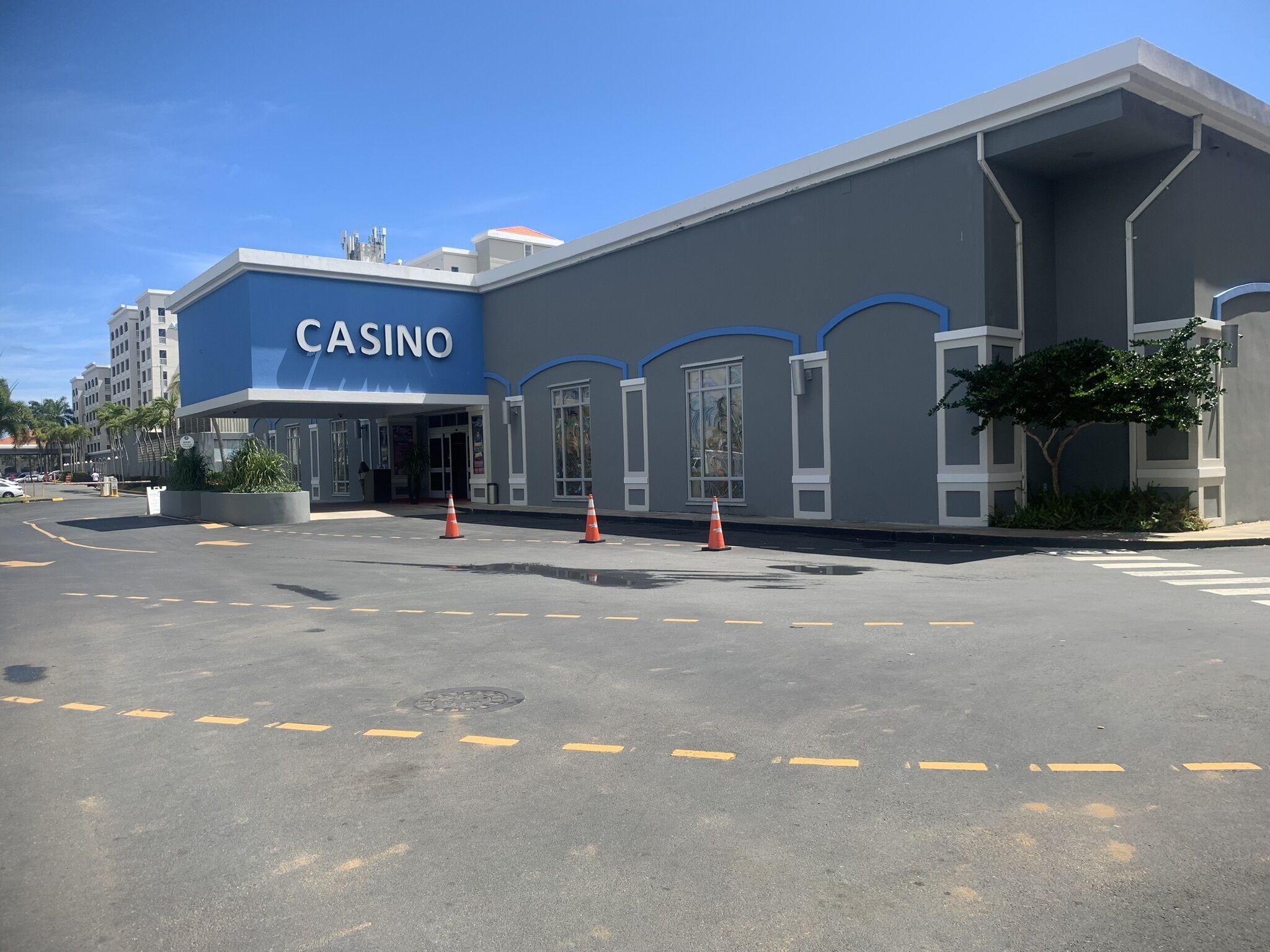 A casino building with a blue facade and large windows.