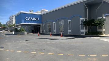 A casino building with a blue facade and large windows.
