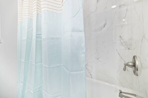 Combined shower/tub, hair dryer, towels, soap - Spacious Gulf Coast Scallop Season Retreat! Near Pine Island Beach, Weeki Wachee, Dog-Friendly (Spring Hill)