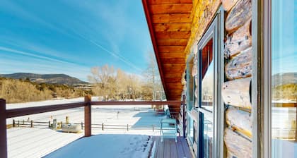 Riverfront home with river & valley views, wood stove, deck, & W/D