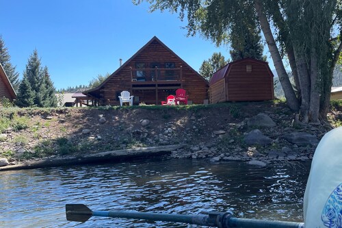 Riverfront home with river & valley views, wood stove, deck, & W/D