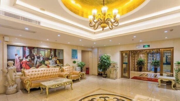 A spacious lobby with a grand chandelier, a plush sofa, and a decorative floor pattern. - Weiyesi Hotel (Shenzhen)