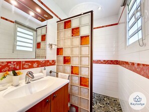 Bathtub, hair dryer, towels, soap