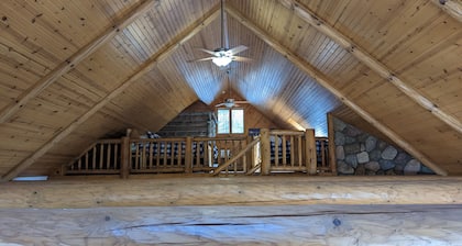 Luxurious Northwoods Log Lake house with over 500ft of lake frontage on 15 acres