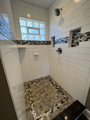 Shower, hair dryer, towels, toilet paper