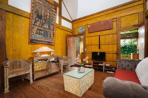 Basic Villa, Multiple Beds | Living area | 32-inch TV with digital channels