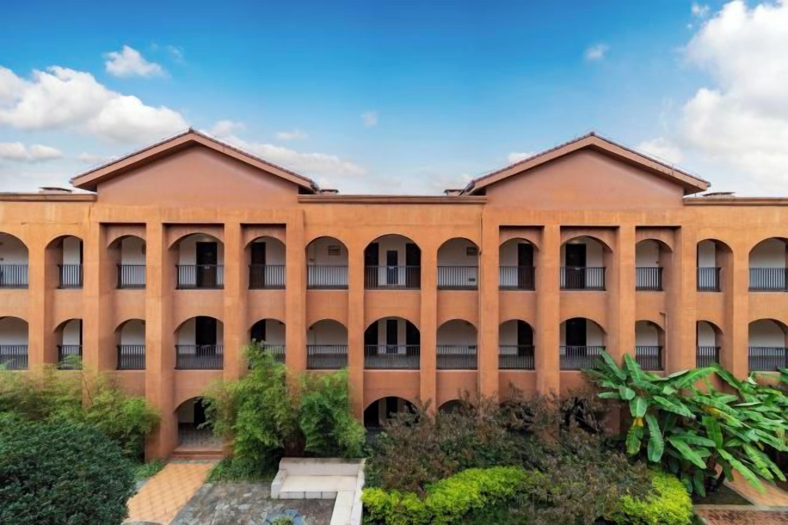 A building with multiple balconies and a central courtyard.
