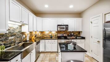 Microwave, dishwasher, coffee/tea maker, cookware/dishes/utensils