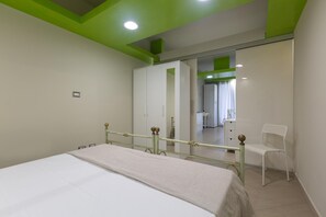 A bedroom with a bed, a chair, a wardrobe, and a mirror. - 3158 Sterlizia House by Barbarhouse (Gallipoli)