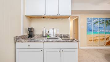 Microwave, dishwasher, coffee/tea maker, cookware/dishes/utensils