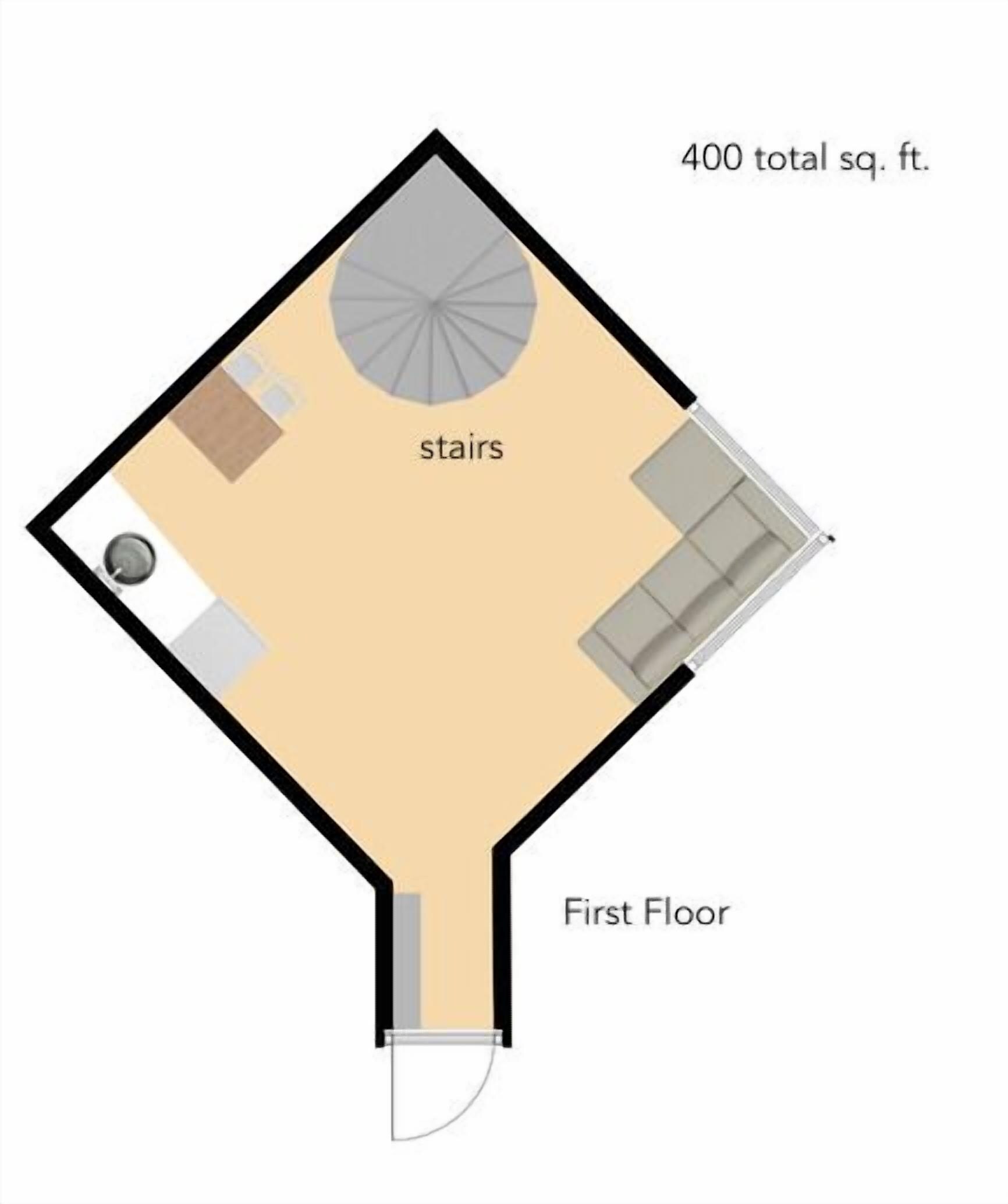 A floor plan of a 400 sq. ft. apartment with a living area, a kitchen, and a staircase.