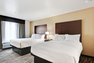 Down comforters, pillowtop beds, desk, laptop workspace