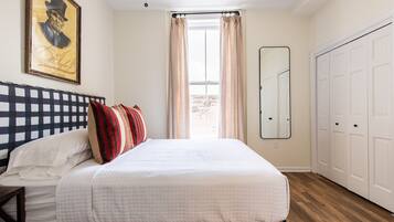 1 bedroom, desk, iron/ironing board, travel crib
