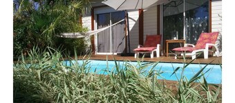 Pretty wooden house with jacuzzi, air conditioning, heated pool, bicycles, internet