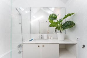 Bathtub, hair dryer, towels, soap