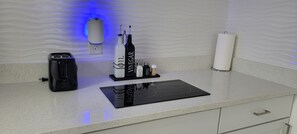 Fridge, microwave, stovetop, coffee/tea maker