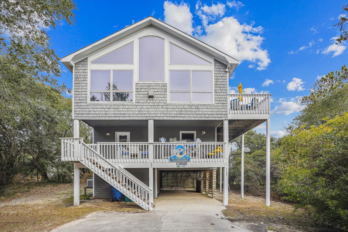 Enjoy this 4 BR oceanside home only a short walk to the beach!