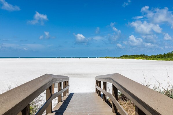 Walk along the boardwalk to the expansive beach.
