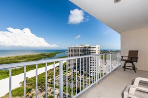 Enjoy the stunning coastal views from this balcony with a clear view of the ocean and surrounding high-rise buildings.