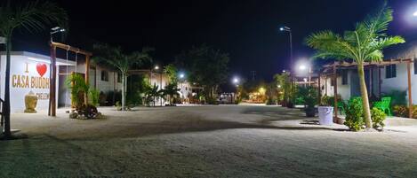 A nighttime view of a resort with a sign reading "I love Casa Budha."