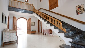 A grand staircase with wooden railings and marble steps, leading to an upper level. - LLAMPUDOL (VILLA SA COMA) - Wonderful villa with private pool and free WiFi. (Sant Llorenç des Cardassar)