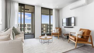 Deluxe Apartment | Living area | 55-inch Smart TV with digital channels, TV, Netflix