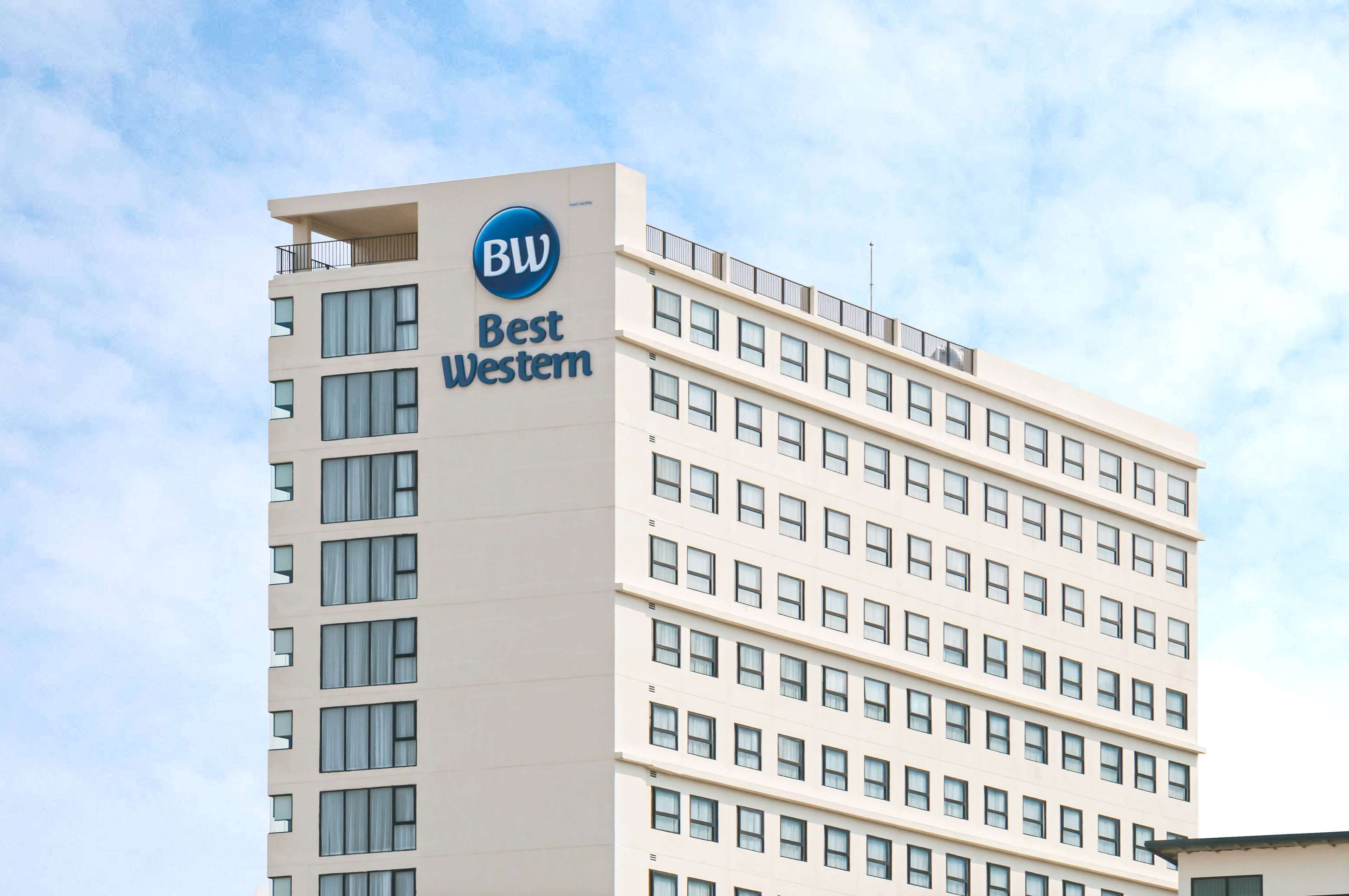 A tall hotel building with a prominent 'Best Western' sign.