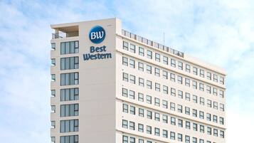 A tall hotel building with a prominent 'Best Western' sign.