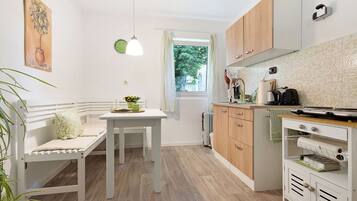 Fridge, microwave, stovetop, coffee/tea maker