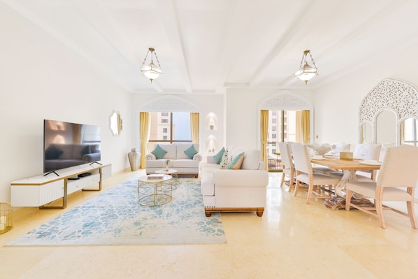 Deluxe 3BR Apartment plus maids room | Living area | 55-inch Smart TV with cable channels, TV
