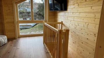 Family Cabin | Living area | 40-inch flat-screen TV with satellite channels, TV, tablet