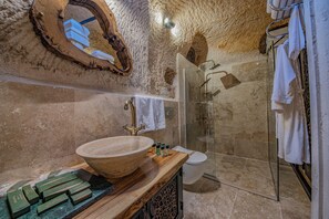 Deluxe Triple Room | Bathroom | Deep soaking tub, rainfall showerhead, hair dryer, bathrobes - Ages in Cappadocia (Nevsehir)