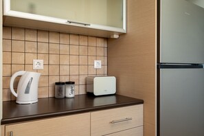 Apartamento | Cozinha privada | Geladeira grande, fogão, cooktop, lava-louças