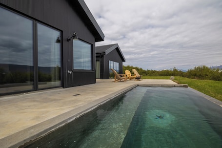 Outdoor pool, a heated pool. Svart Lodge
